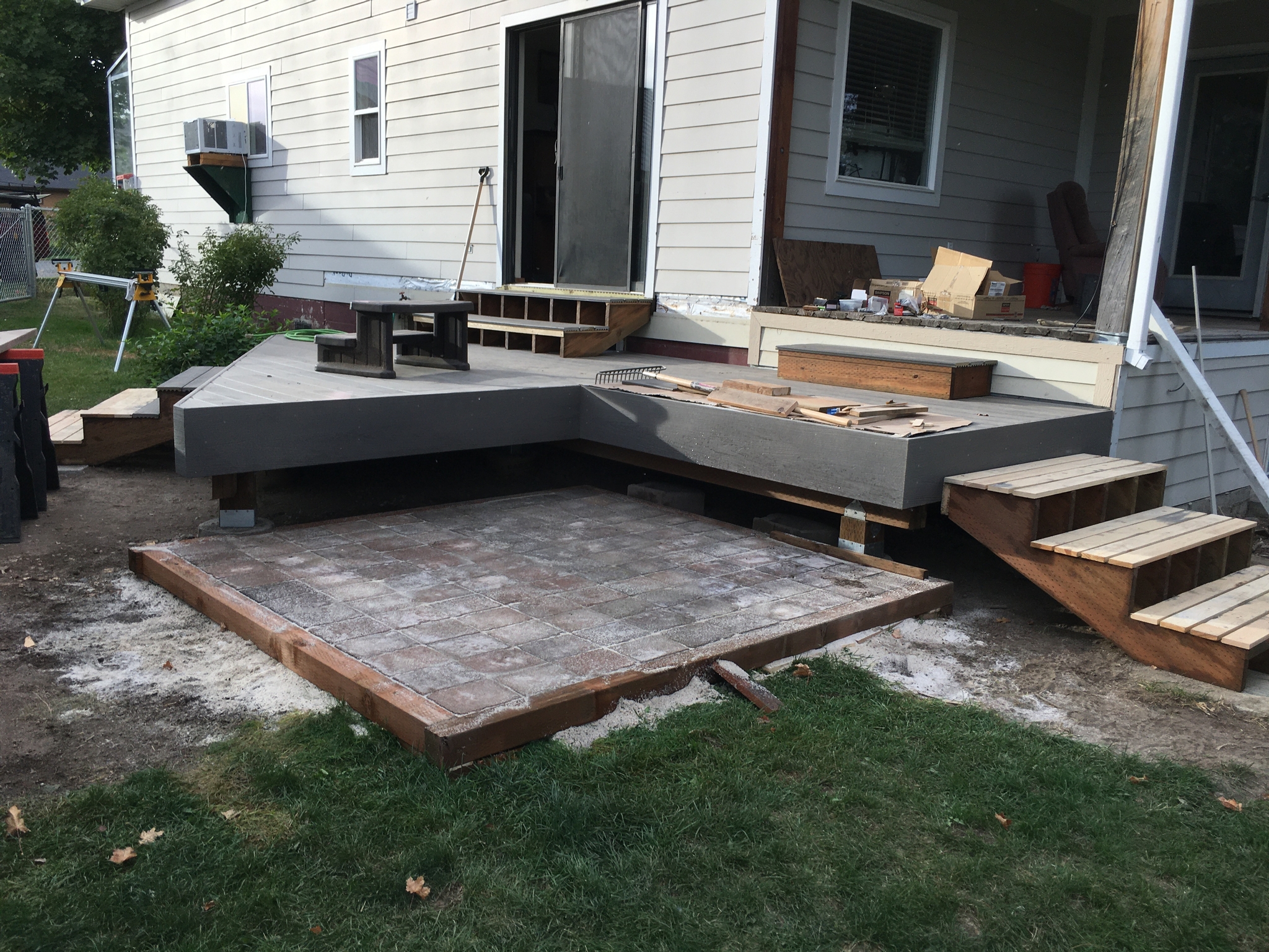 Hot tub pad constructed of patio pavers.